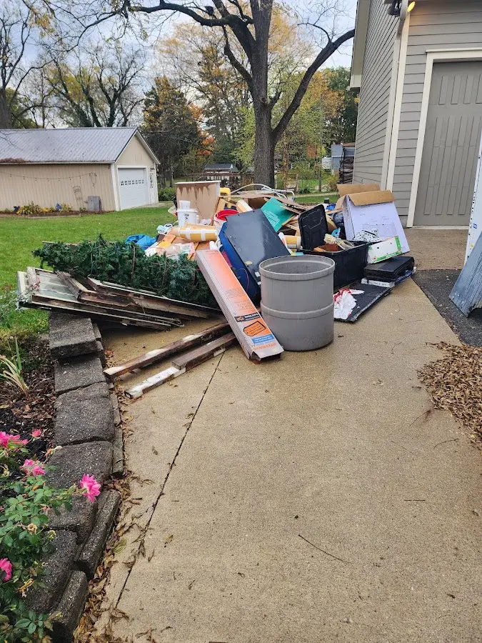 Dumpster being loaded with debris for 30 Yard Dumpster Rental in Shiloh